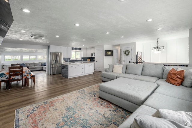1155 E 300 N, American Fork, UT 84003 - living area with dark wood-style flooring, recessed lighting, and a chandelier