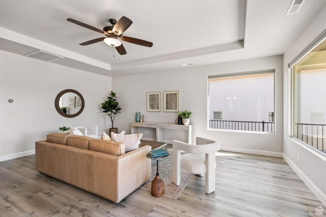 1867 W Grapevine, Hurricane, UT 84737 - living area with a raised ceiling, ceiling fan, light wood-type flooring, and baseboards