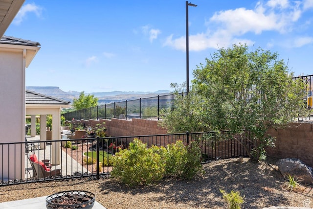 1867 W Grapevine, Hurricane, UT 84737 - fenced backyard featuring a mountain view and a patio