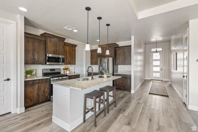 1867 W Grapevine, Hurricane, UT 84737 - kitchen featuring stainless steel appliances, a sink, light wood finished floors, dark brown cabinets, and recessed lighting