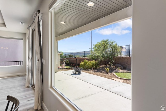 1867 W Grapevine, Hurricane, UT 84737 - doorway to outside featuring baseboards and wood finished floors