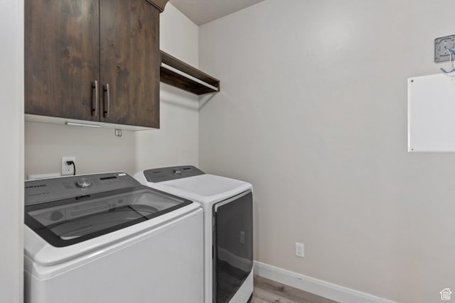 1867 W Grapevine, Hurricane, UT 84737 - clothes washing area with independent washer and dryer, cabinet space, light wood-style flooring, and baseboards