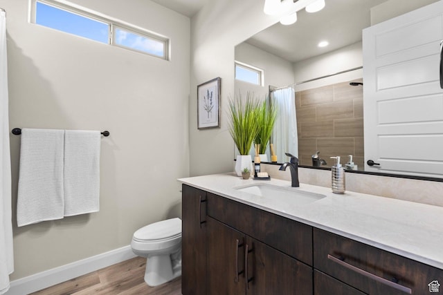 1867 W Grapevine, Hurricane, UT 84737 - full bath featuring wood finished floors, baseboards, toilet, vanity, and a shower with curtain