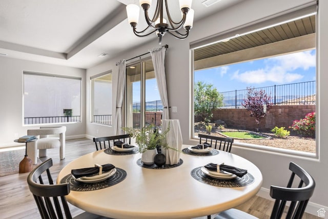 1867 W Grapevine, Hurricane, UT 84737 - dining area with a chandelier, wood finished floors, and baseboards