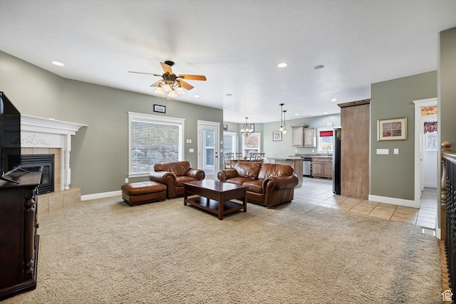 240 Bugle Way, Providence, UT 84332 - living area featuring a tile fireplace, a ceiling fan, light carpet, light tile patterned floors, and recessed lighting