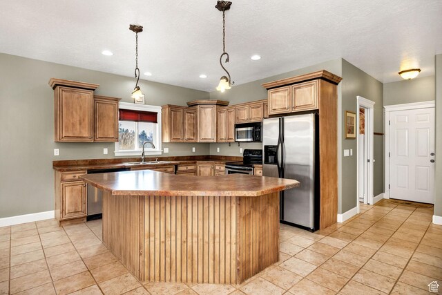240 Bugle Way, Providence, UT 84332 - kitchen with baseboards, appliances with stainless steel finishes, a sink, hanging light fixtures, and a center island