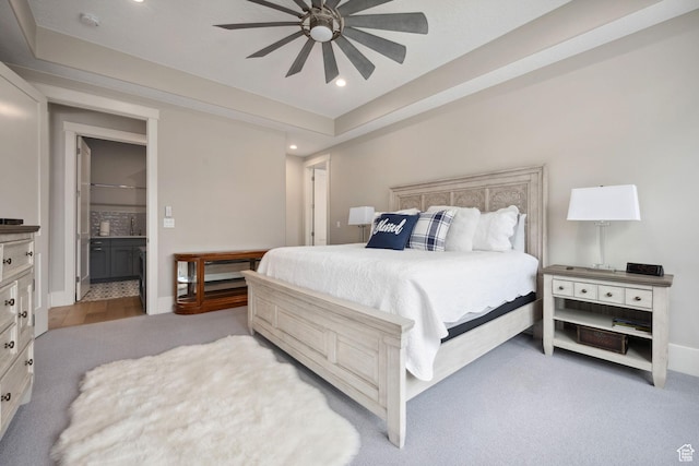 bedroom with ensuite bathroom, baseboards, ceiling fan, and recessed lighting