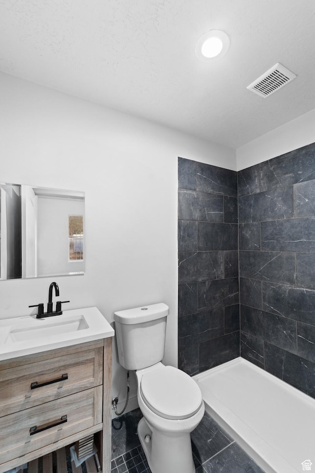 2814 S 9100 W, Magna, UT 84044 - bathroom with toilet, vanity, and tiled shower