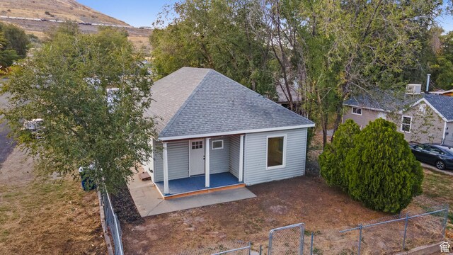 2814 S 9100 W, Magna, UT 84044 - view of front of house featuring roof with shingles and a patio