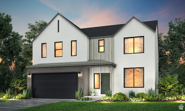 modern inspired farmhouse featuring a standing seam roof, driveway, a garage, and metal roof
