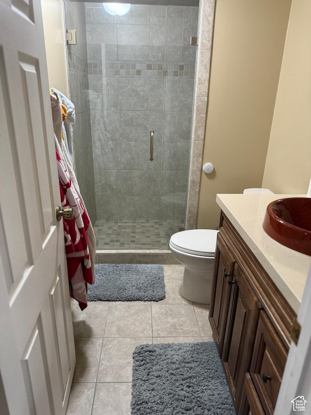 120 E Deseret Cir, Grantsville, UT 84029 - bathroom with vanity, toilet, a shower stall, and tile patterned flooring