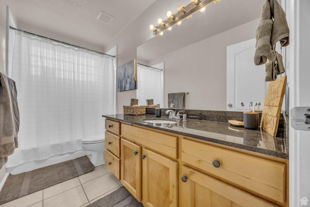 full bathroom featuring toilet, vanity, tile patterned flooring, visible vents, and shower / bath combination with curtain