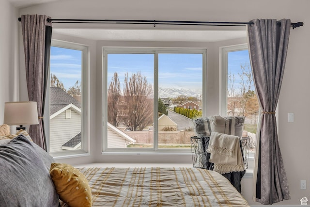 bedroom with multiple windows