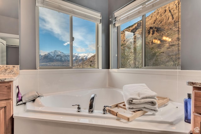 692 N Harrison Blvd, Ogden, UT 84404 - full bath with vanity, a bath, and a mountain view
