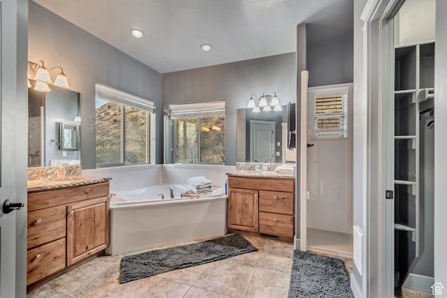 692 N Harrison Blvd, Ogden, UT 84404 - full bathroom featuring two vanities, a chandelier, and a bath