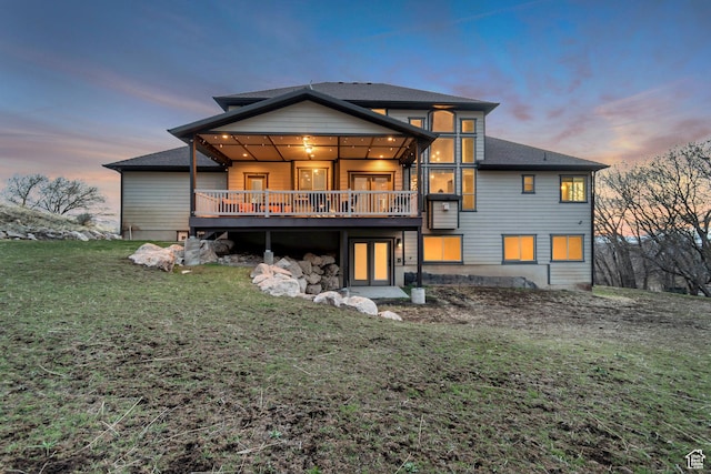 692 N Harrison Blvd, Ogden, UT 84404 - rear view of property with a lawn, a wooden deck, and a shingled roof