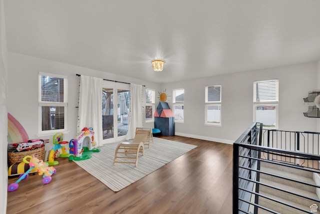 3225 N 1000 W, Pleasant View, UT 84414 - game room with a wealth of natural light, wood finished floors, and baseboards