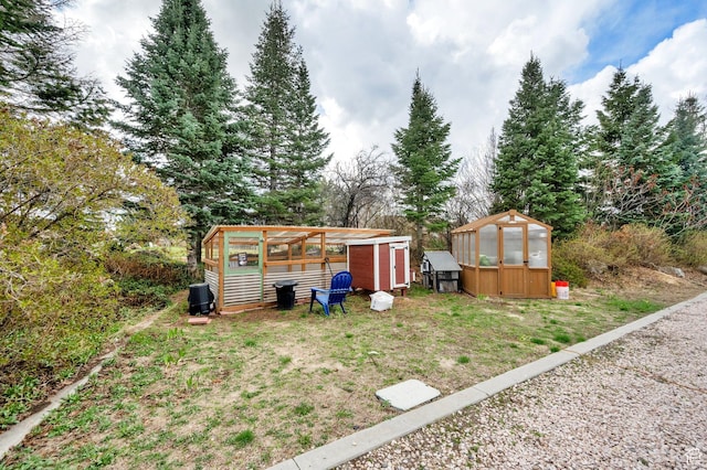 3225 N 1000 W, Pleasant View, UT 84414 - view of yard with an outbuilding and an exterior structure