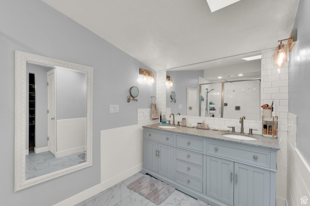 3225 N 1000 W, Pleasant View, UT 84414 - full bath with marble finish floor, double vanity, a sink, and a shower stall