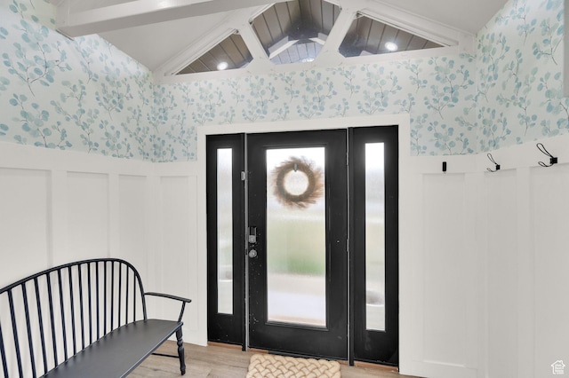 3225 N 1000 W, Pleasant View, UT 84414 - entryway with lofted ceiling with beams, a wainscoted wall, a decorative wall, light wood-style flooring, and wallpapered walls