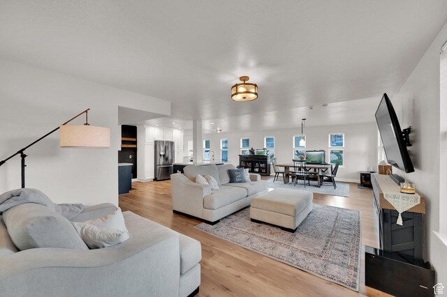3225 N 1000 W, Pleasant View, UT 84414 - living room featuring light wood finished floors