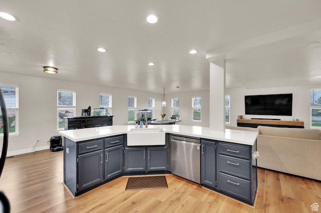3225 N 1000 W, Pleasant View, UT 84414 - kitchen featuring open floor plan, light countertops, a sink, and stainless steel dishwasher