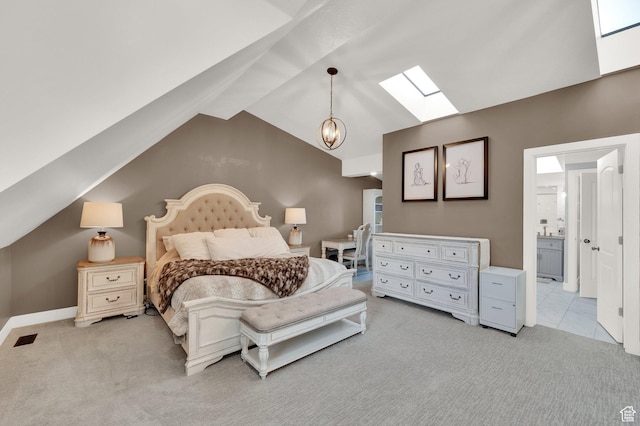 3225 N 1000 W, Pleasant View, UT 84414 - bedroom featuring light colored carpet, baseboards, connected bathroom, vaulted ceiling with skylight, and visible vents
