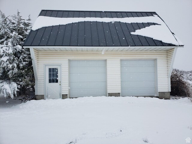 28848 N 11170 E, Milburn, UT 84629 - snow covered garage with a garage