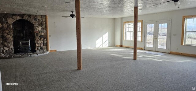 28848 N 11170 E, Milburn, UT 84629 - unfurnished living room with a textured ceiling, carpet flooring, and a ceiling fan