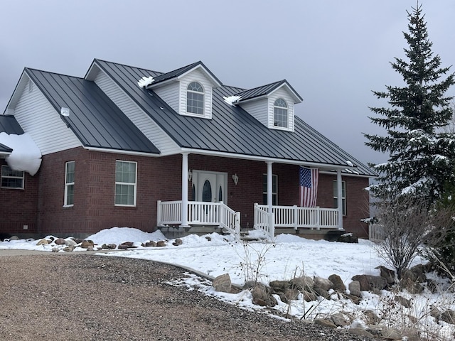 28848 N 11170 E, Milburn, UT 84629 - view of front of home featuring metal roof, covered porch, a standing seam roof, and brick siding