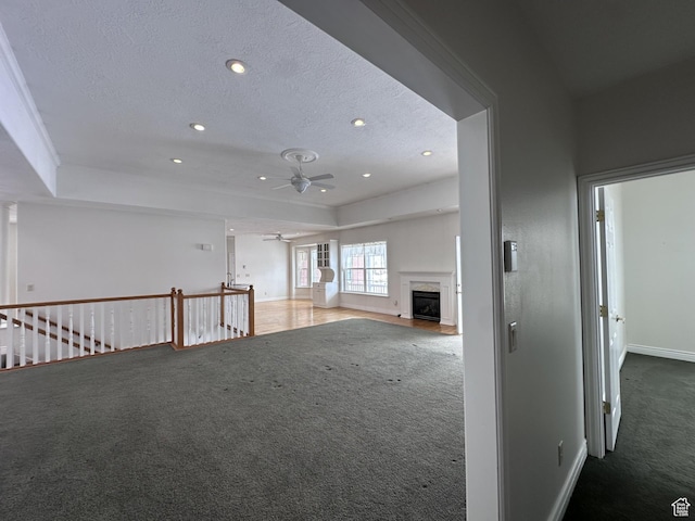 28848 N 11170 E, Milburn, UT 84629 - interior space with carpet flooring, a textured ceiling, a high end fireplace, and ceiling fan