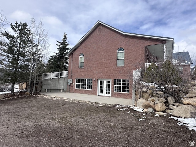 28848 N 11170 E, Milburn, UT 84629 - back of house with brick siding, a patio area, and french doors