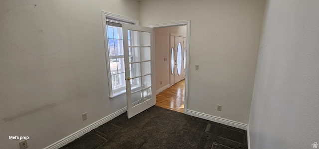 28848 N 11170 E, Milburn, UT 84629 - entryway featuring dark colored carpet, plenty of natural light, and baseboards