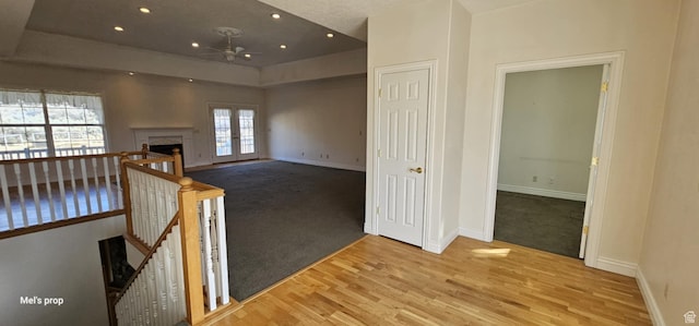 28848 N 11170 E, Milburn, UT 84629 - interior space featuring carpet floors, an upstairs landing, baseboards, and wood finished floors