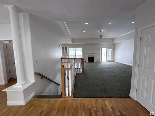 28848 N 11170 E, Milburn, UT 84629 - stairs with decorative columns, a ceiling fan, wood finished floors, a textured ceiling, and baseboards