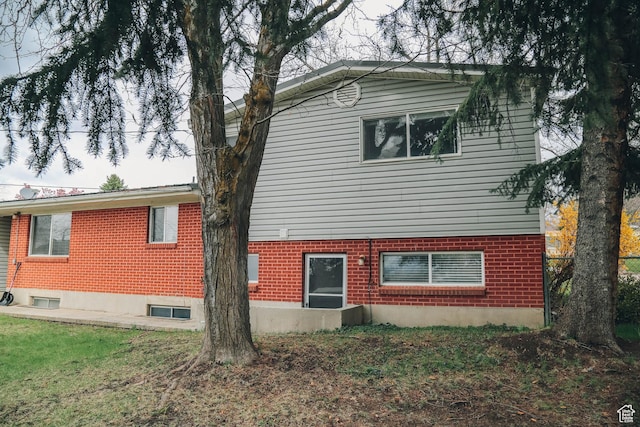 view of side of property with brick siding