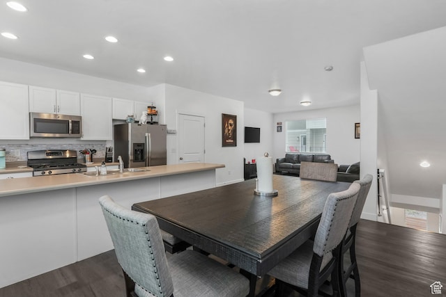 dining space featuring recessed lighting and dark wood finished floors