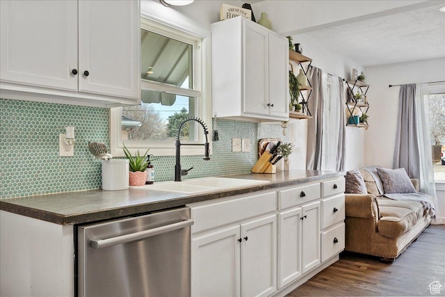 1335 Swan St, Ogden, UT 84401 - kitchen with white cabinets, tasteful backsplash, dishwasher, and a sink