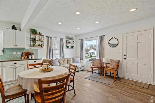 1335 Swan St, Ogden, UT 84401 - dining room featuring recessed lighting, light wood-style floors, a textured ceiling, and baseboards