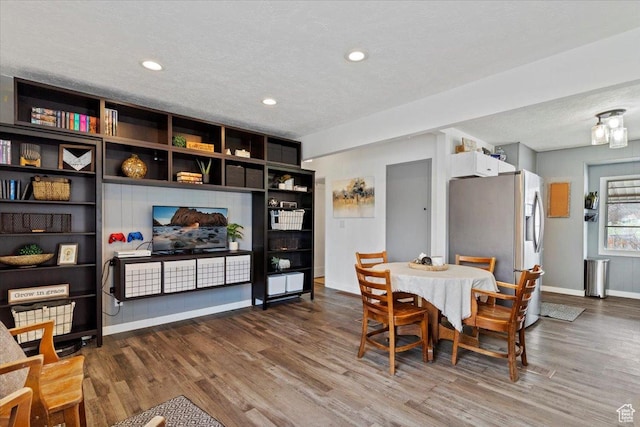 1335 Swan St, Ogden, UT 84401 - dining room with recessed lighting, wood finished floors, and baseboards