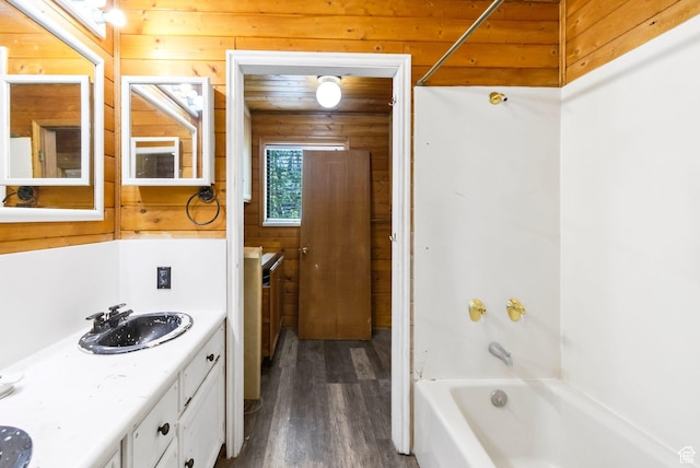 605 E 400 N, Richfield, UT 84701 - bathroom with wood finished floors, wood walls, double vanity, and shower / tub combination