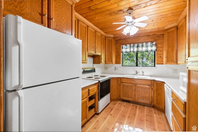 605 E 400 N, Richfield, UT 84701 - kitchen with white appliances, a sink, light wood finished floors, light countertops, and brown cabinets