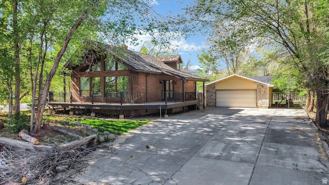 605 E 400 N, Richfield, UT 84701 - view of property exterior featuring an outbuilding, driveway, brick siding, and a deck