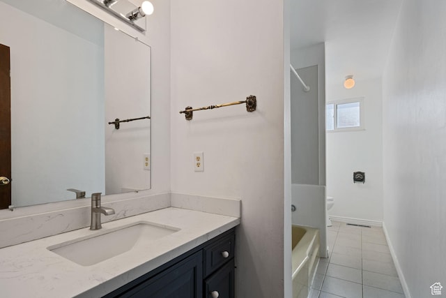 bathroom with vanity, visible vents, toilet, tile patterned floors, and baseboards