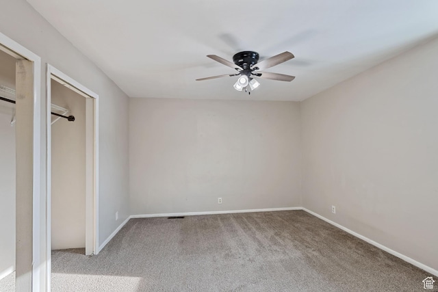 unfurnished bedroom with baseboards, a ceiling fan, and carpet floors