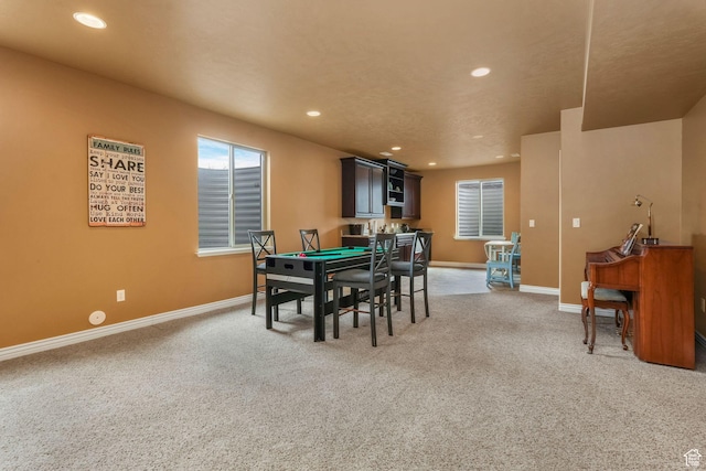 dining space with light carpet, baseboards, and recessed lighting