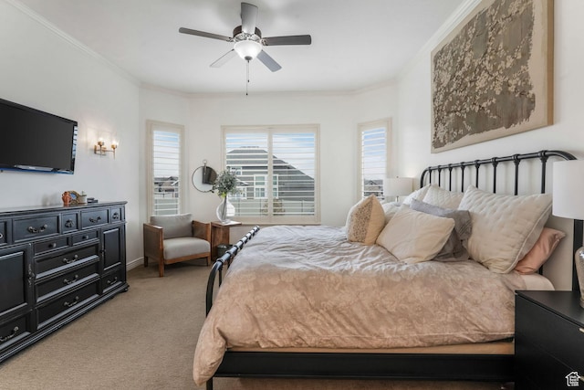 bedroom with ornamental molding, a ceiling fan, and light carpet