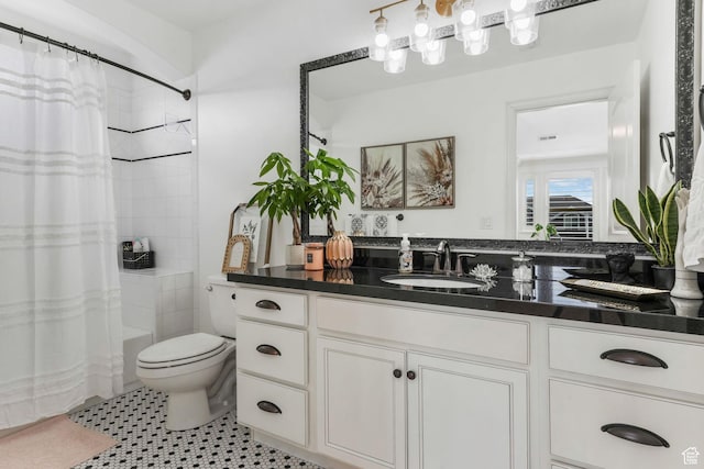 bathroom with toilet, vanity, curtained shower, and tile patterned flooring