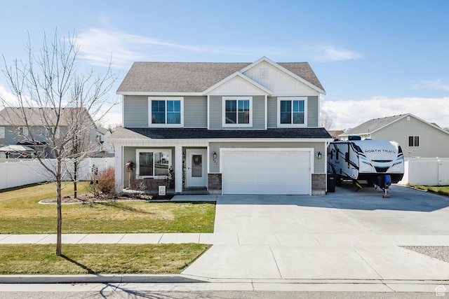 view of front of home featuring driveway, a front yard, roof with shingles, an attached garage, and fence