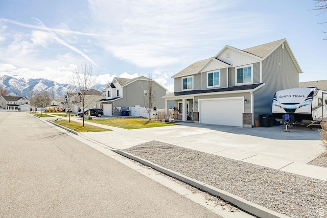 802 W 1060 S, Logan, UT 84321 - view of front of house with roof with shingles, a residential view, driveway, a mountain view, and a garage